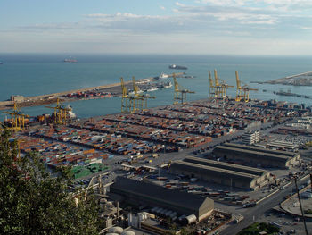 High angle view of harbor by sea against sky