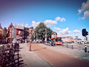 City street by buildings against sky