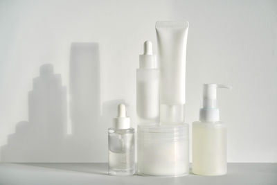 Close-up of bottles against white background