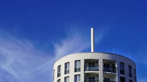 Low angle view of building against blue sky