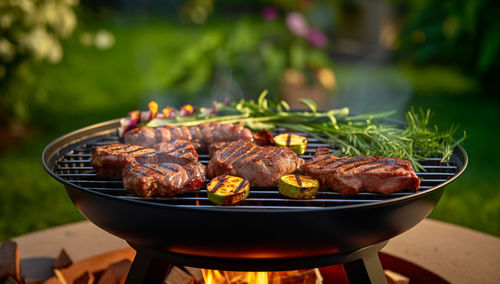 Close-up of meat on barbecue grill