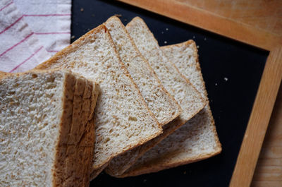 High angle view of bread on cutting board