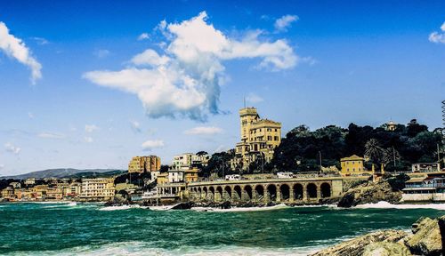 View of sea against sky in city