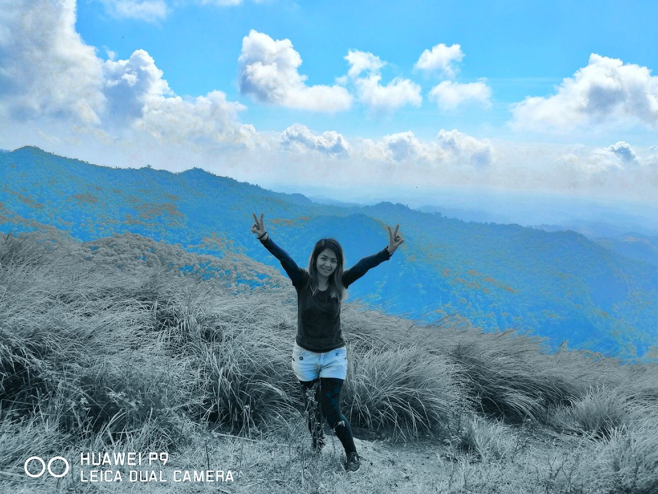 one person, vitality, cloud - sky, freedom, sky, one woman only, blue, full length, arms raised, mid-air, adults only, outdoors, happiness, jumping, beauty in nature, adventure, day, people, one young woman only, only women, real people, adult, nature, young adult, freshness