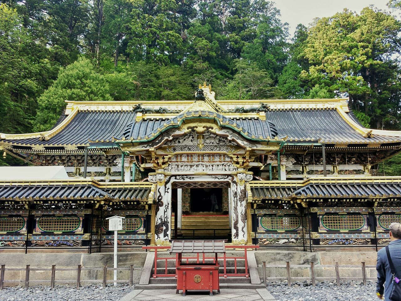 building exterior, architecture, tree, built structure, religion, place of worship, spirituality, temple - building, art and craft, art, statue, day, travel destinations, entrance, travel, outdoors, roof, temple, facade