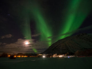 Aurora borealis, pliades and the moon near alta, norway.