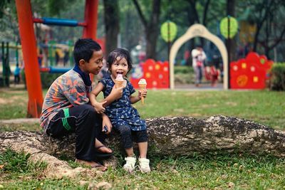 Full length of father and daughter outdoors