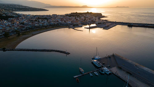 High angle view of bridge over sea against sky during sunset