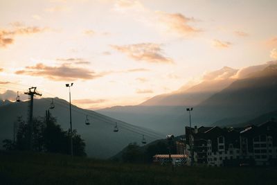 Silhouette buildings against sky during sunset