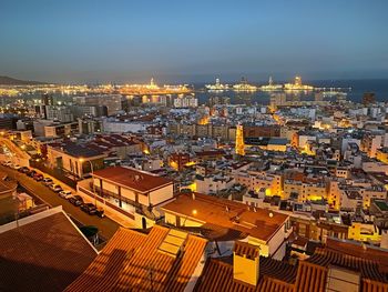 High angle view of illuminated buildings in city