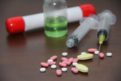 Close-up of multi colored bottles on table