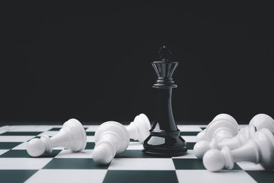 Close-up of chess board against black background