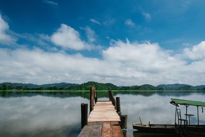 Pier over lake against sky