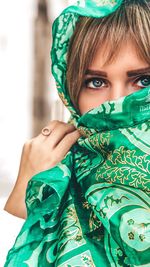 Portrait of cute girl holding eyeglasses