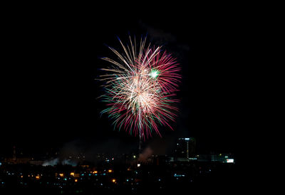 Firework display at night