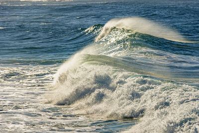Sea waves splashing on shore