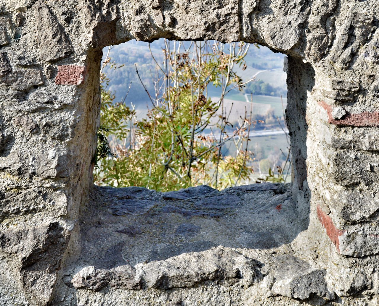 CLOSE-UP OF WINDOW ON OLD WALL