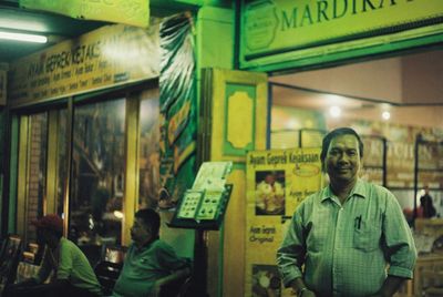 Portrait of people standing at store