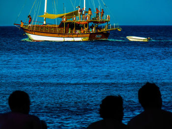 People on boat in sea