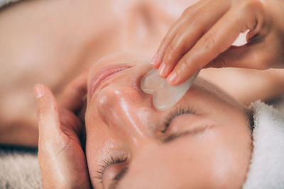 Close-up of woman getting massage therapy at spa