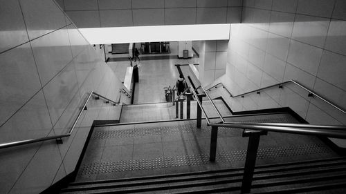 High angle view of steps at illuminated subway station