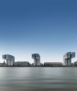 Modern cityscape against clear sky