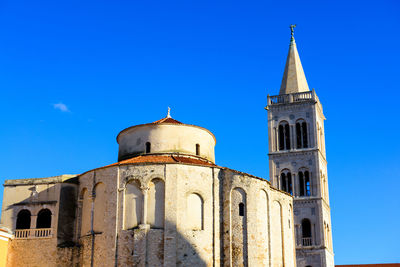 Low angle view of building against blue sky