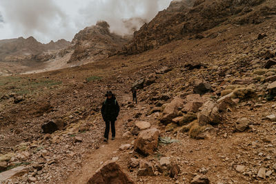 Full length of people walking on terrain