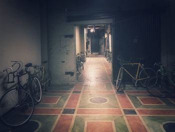 Empty alley along built structures