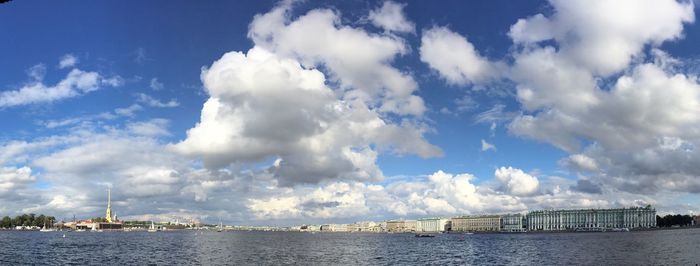 City by neva river against sky