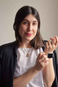 Young woman using smart watch