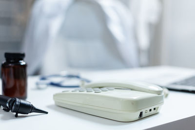 Close-up of mobile phone on table