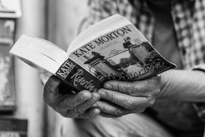 Close-up of person holding paper