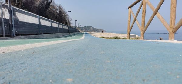 Surface level of bridge against clear sky