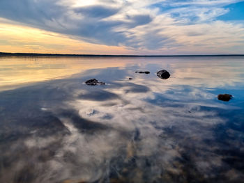 Scenic view of sea against sky during sunset