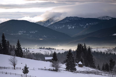 Scenic view of snowcapped mountains against sky