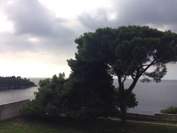 Scenic view of sea against cloudy sky