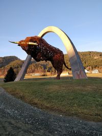 View of horse on field against clear sky