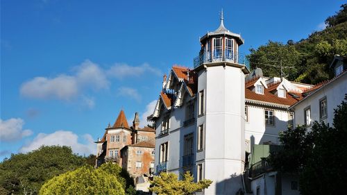 Low angle view of buildings against blue sky