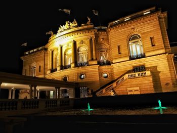 Low angle view of illuminated building at night