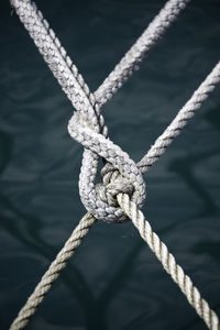 Close-up of rope tied on metal