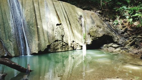 Scenic view of river against mountain