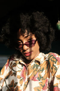 Close-up portrait of young woman looking at camera