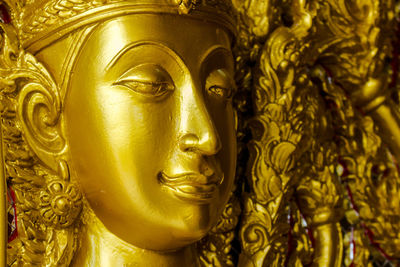 Close-up of golden religious statue