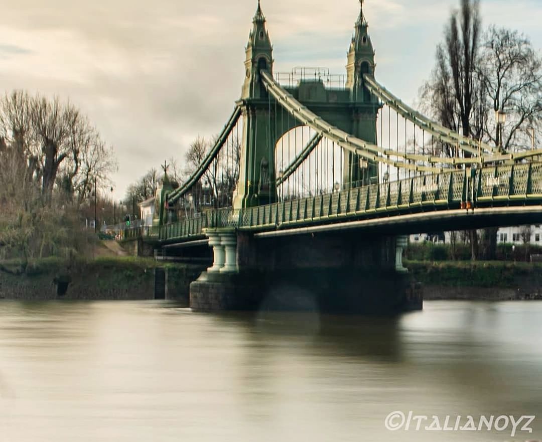 bridge, architecture, built structure, bridge - man made structure, water, connection, transportation, river, sky, travel destinations, building exterior, nature, city, travel, tourism, no people, suspension bridge, cloud - sky, waterfront, outdoors, long