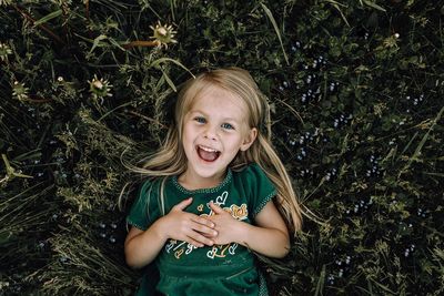 Portrait of a smiling girl with plants