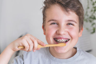 Close-up of young woman holding fork