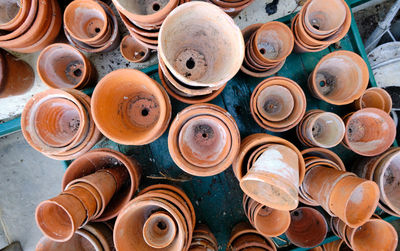 Flower pots. random piles and stacks of vintage terracotta flowerpots. top down view.