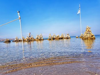 Scenic view of sea against blue sky