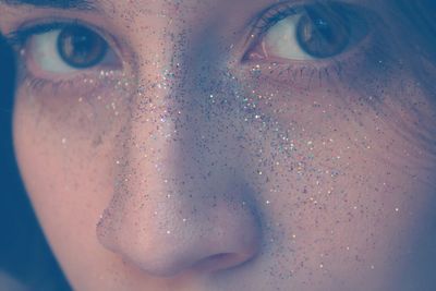 Cropped image of woman with glitter on face